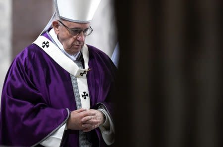 FILE PHOTO - Pope Francis leaves at the end of the Ash Wednesday mass at Santa Sabina Basilica in Rome, Italy, February 14, 2018.  REUTERS/Alberto Lingria