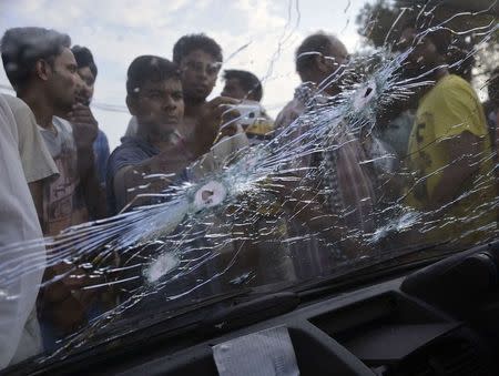 Bullet holes are seen on the windscreen of a car that was damaged in a gunfight in Dinanagar town in Gurdaspur district of Punjab, July 27, 2015. REUTERS/Mukesh Gupta