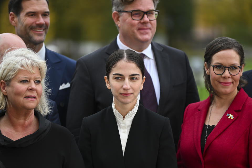 New Climate and Environment Minister Romina Pourmokhtari (C), is pictured during a group photo in front of the Parliament in Stockholm, on October 18, 2022.