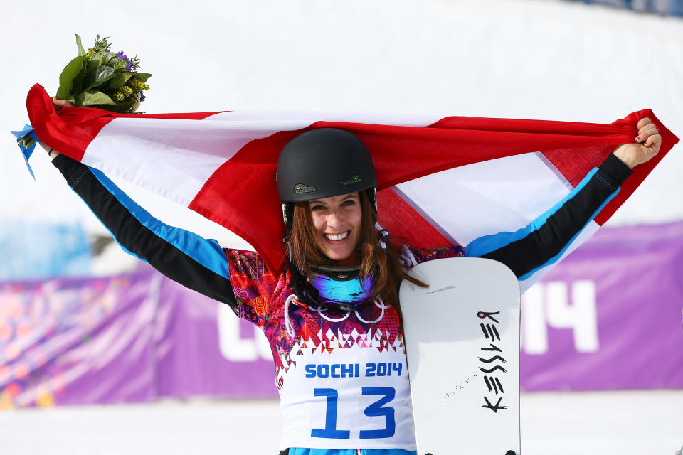 SOCHI, RUSSIA - FEBRUARY 22:  Julia Dujmovits of Austria celebrates winning the gold medal during the flower ceremony in the Snowboard Ladies' Parallel Slalom Big Final on day 15 of the 2014 Winter Olympics at Rosa Khutor Extreme Park on February 22, 2014 in Sochi, Russia.  (Photo by Cameron Spencer/Getty Images)