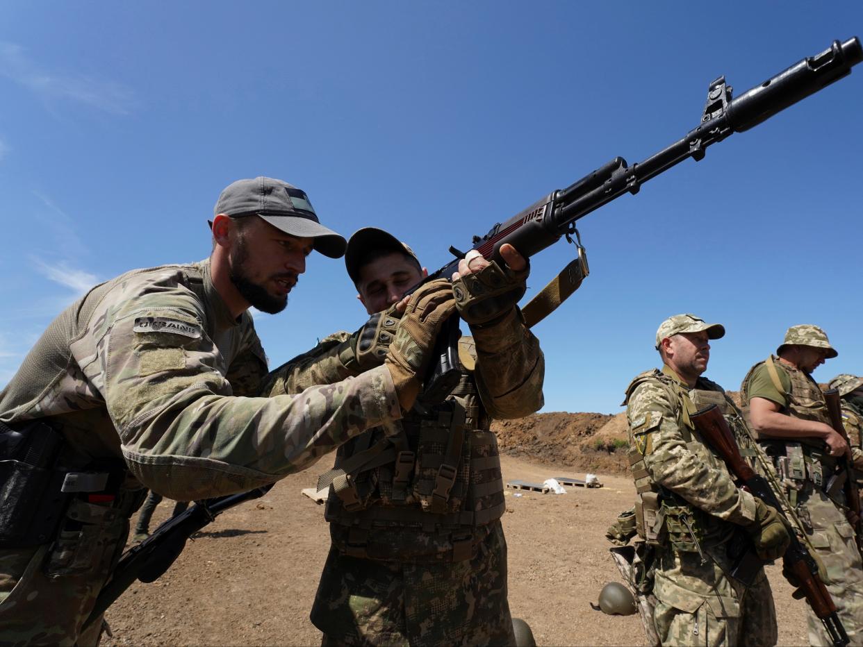 Servicemen of the newly created National Guard unit train in the Kharkiv region (AP)