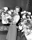 FILE - Cloris Leachman is shown in her dressing room at the Majestic Theater with floral arrangements she received for assuming the lead in Broadway's "South Pacific" in New York City on Oct. 13, 1952. Leachman, a character actor whose depth of talent brought her an Oscar for the "The Last Picture Show" and Emmys for her comedic work in "The Mary Tyler Moore Show" and other TV series, has died. She was 94. (AP Photo, File)