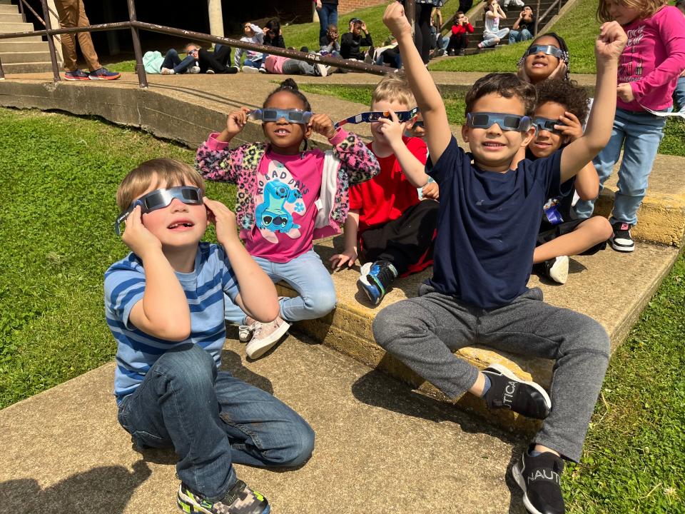 Kindergarten students watch the eclipse with excitement at Riverside Elementary School on the school lawn. (Front left) Grayson Chaney, Tamia Booker, Kelvin Speed take their eyes to the skies. (Back left) Ryan Lawson, Sincere Buford, Journee Bardwell and Winter Ray enjoy their first eclipse.