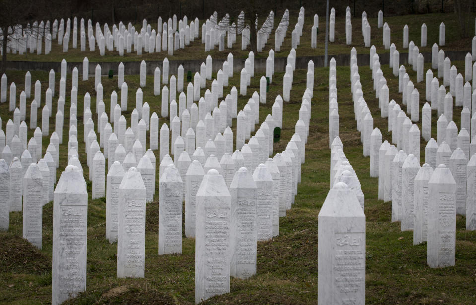 This Saturday, March 16, 2019 photo shows tombs at the memorial cemetery for massacre victims in Potocari, near Srebrenica, Bosnia-Herzegovina. Nearly a quarter of a century since Bosnia's devastating war ended, former Bosnian Serb leader Radovan Karadzic is set to hear the final judgment on whether he can be held criminally responsible for unleashing a wave of murder and mistreatment by his administration's forces. United Nations appeals judges on Wednesday March 20, 2019 will decide whether to uphold or overturn Karadzic's 2016 convictions for genocide, crimes against humanity and war crimes and his 40-year sentence. (AP Photo/Darko Bandic)