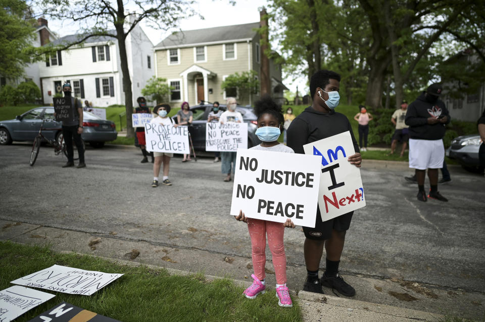 Deshawn Williams, 15, and his sister, Sarah Newell, 7, protest outside Hennepin County Attorney Mike Freeman's home in Minneapolis on May 27. | Aaron Lavinsky—Star Tribune/Sipa USA