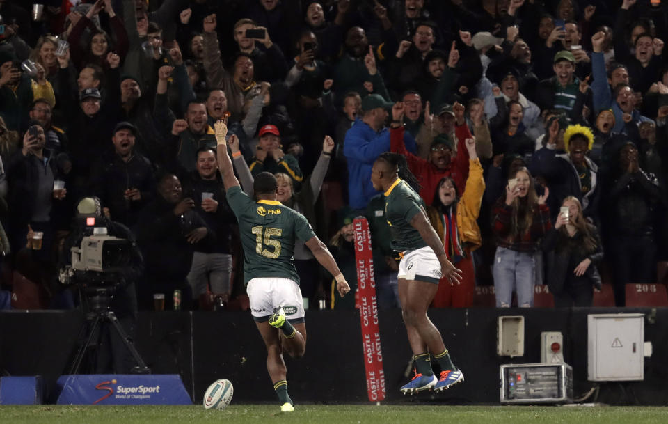 South Africa's S'bu Nkosi, right, celebrates with teammate Warrick Gelant after scoring a try during the Rugby Championship match between South Africa and Australia at Ellis Park stadium in Johannesburg, South Africa, Saturday, July 20, 2019. (AP Photo/Themba Hadebe)