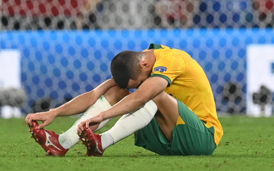 Aziz Behich of Australia reacts after the FIFA World Cup 2022 round of 16 soccer match between Argentina and Australia at Ahmad bin Ali Stadium in Doha - Shutterstock