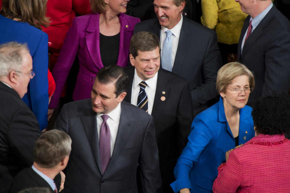 UNITED STATES - JANUARY 28: From left, Sens. Ted Cruz, R-Texas, Mark Begich, D-Alaska, Jeff Flake, R-Ariz., and Elizabeth Warren, D-Mass., greet members of Congress upon arriving in the House Chamber of the Capitol to hear President Barack Obama deliver his State of the Union address. (Photo By Tom Williams/CQ Roll Call)