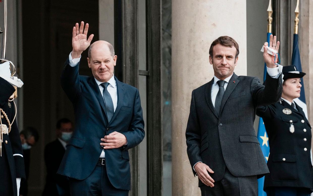 Germany's Olaf Scholz and Emmanuel Macron at an earlier meeting. The two leaders will talk on Tuesday to try and form a common position on retaliation if Russia invades Ukraine. - AP