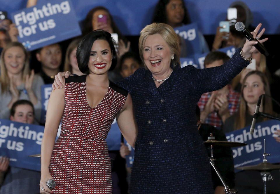 U.S. Democratic presidential candidate Hillary Clinton is joined by singer Demi Lovato at a campaign event in Iowa City, Iowa, United States, January 21, 2016.   REUTERS/Jim Young