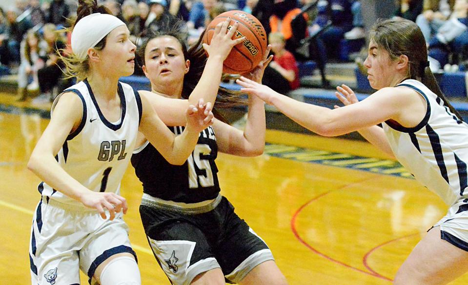 Waverly-South Shore's Capri Schroeder (15) is trapped by  Great Plains Lutheran defenders Halle Bauer (1) and Myra Lentz during a high school boys-girls basketball doubleheader on Thursday, Feb. 16, 2023 in Watertown.