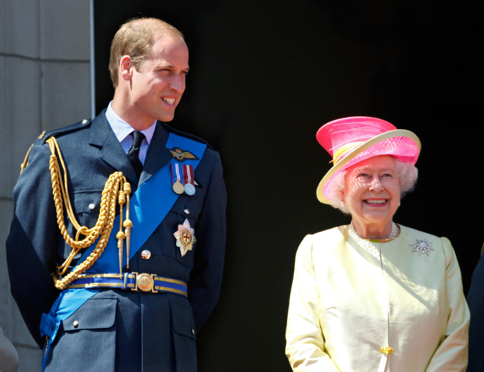 LONDON, UNITED KINGDOM - JULY 10: (EMBARGOED FOR PUBLICATION IN UK NEWSPAPERS UNTIL 48 HOURS AFTER CREATE DATE AND TIME) Prince William, Duke of Cambridge and Queen Elizabeth II watch a flypast of Spitfire & Hurricane aircraft from the balcony of Buckingham Palace to commemorate the 75th Anniversary of The Battle of Britain on July 10, 2015 in London, England. (Photo by Max Mumby/Indigo/Getty Images)