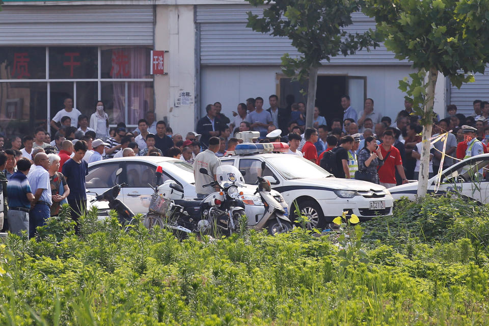 <p>Onlookers and security personnel gather near the scene of an explosion at a kindergarten in Fengxian County in Jiangsu Province, China, June 16, 2017. (Photo: Aly Song/Reuters) </p>