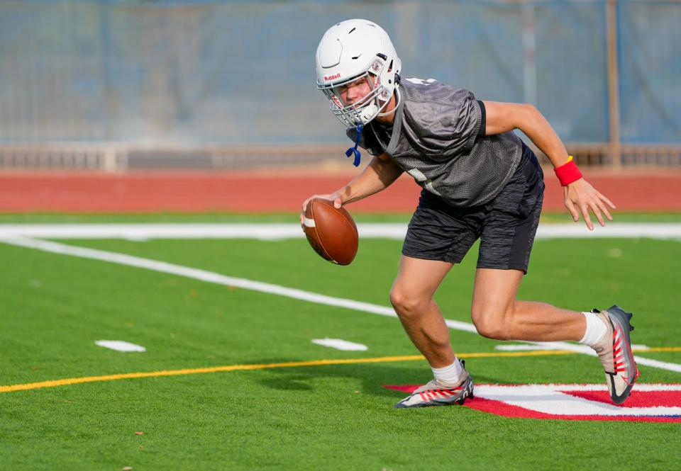 Aug. 9, 2022; Phoenix, Ariz., U.S.; Sophomore quarterback Luke Haugo (7) runs the ball during practice at North High School in Phoenix.