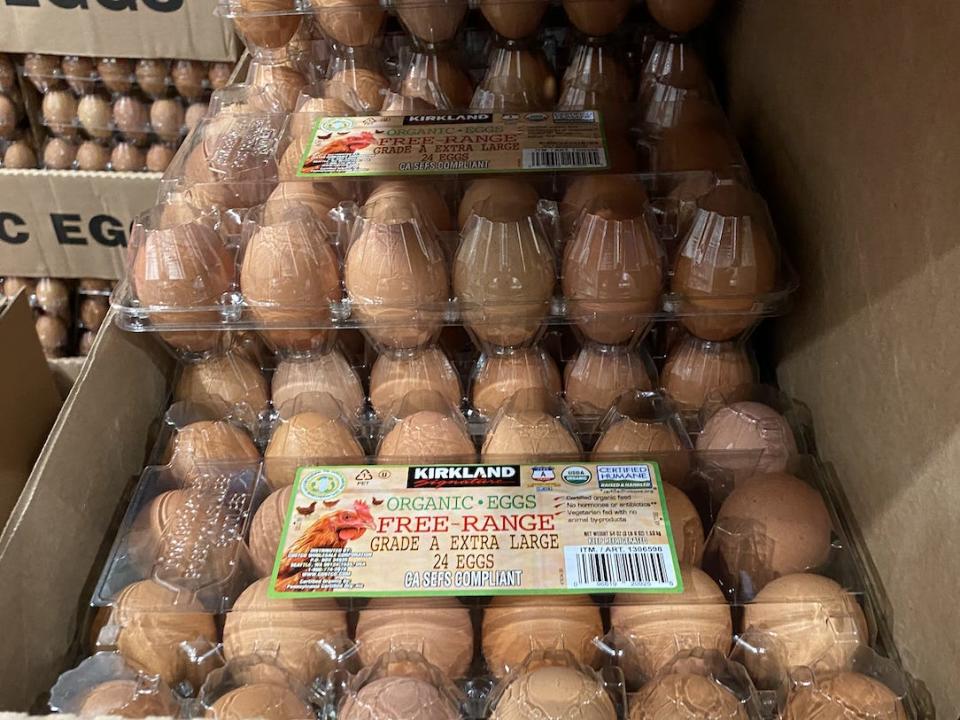 Kirkland 24-packs of brown eggs stacked in boxes at costco