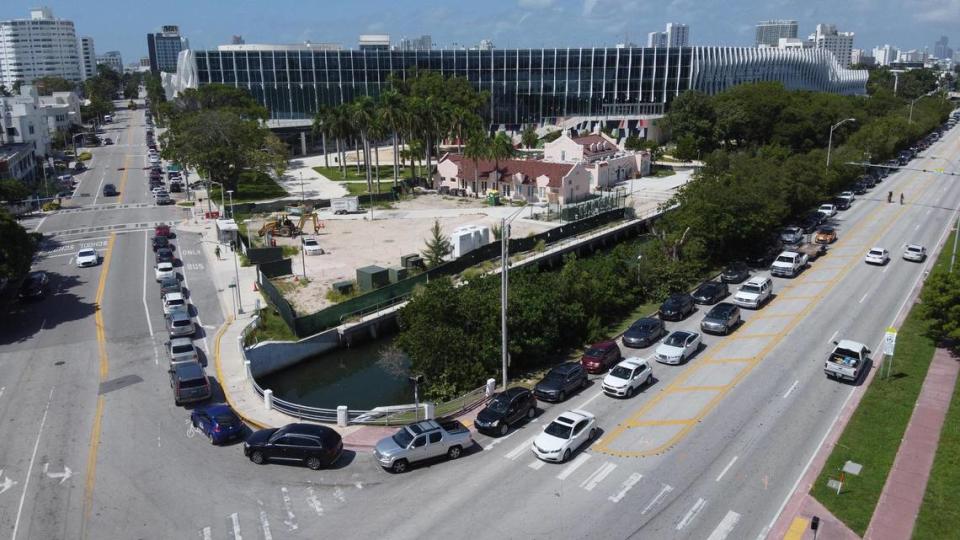 A long line of cars waiting to enter the COVID-19 drive-through testing site wraps around the Miami Beach Convention Center at the intersection of Dade Boulevard and Washington Avenue on June 25, 2020, around 11 a.m.