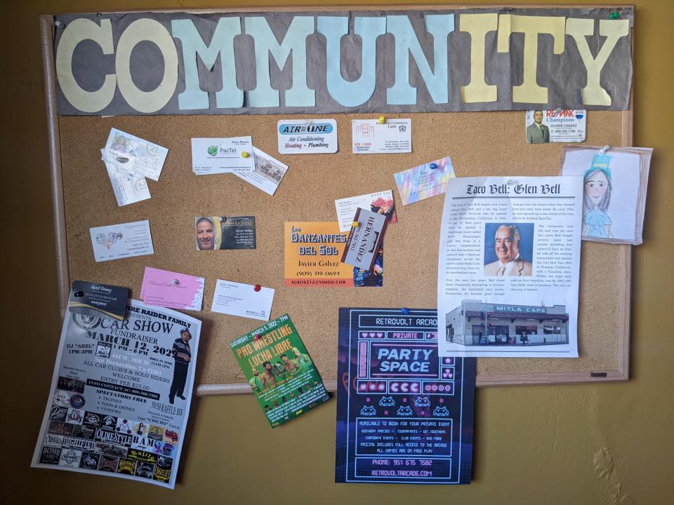 A cork board at Mitla Cafe in San Bernardino, California, an 85-year-old restaurant that inspired Taco Bell's creation.