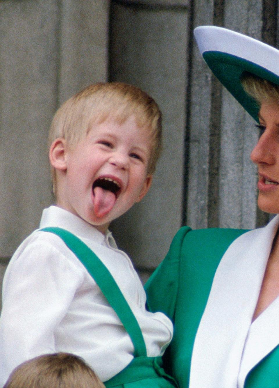 Prince Harry sticks his tongue out on the balcony of Buckingham Palace