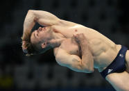 Jack Laugher of Britain competes in men's diving 3m springboard final at the Tokyo Aquatics Centre at the 2020 Summer Olympics, Tuesday, Aug. 3, 2021, in Tokyo, Japan. (AP Photo/Dmitri Lovetsky)