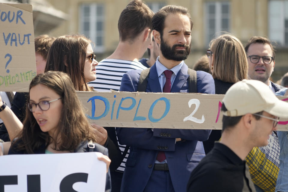 Diplomats strike near the French Foreign Ministry, Thursday, June 2, 2022 in Paris. Members of the French diplomatic corps are dropping their traditional reserve to go on a rare strike, angered by a planned reform they worry will hurt their careers and France's standing in the world. (AP Photo/Nicolas Garriga)