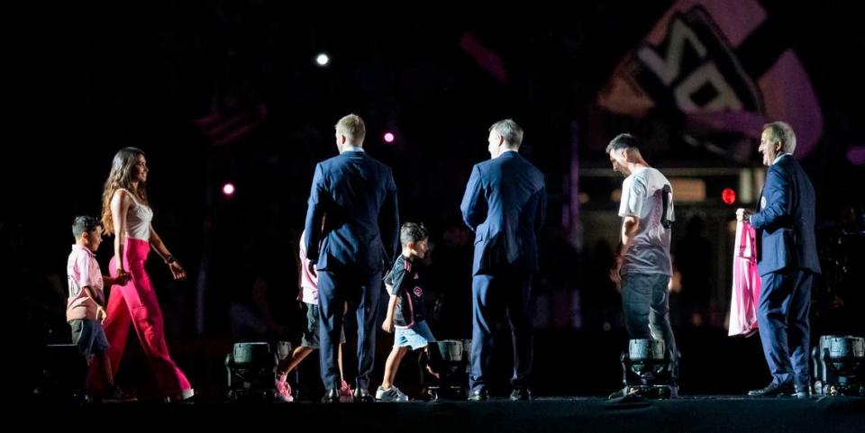 Lionel Messi’s wife, Antonela Roccuzzo, and sons, Thiago, Mateo and Ciro walk on the stage during Inter Miami’s The Unveil event at DRV PNK Stadium on Sunday, July 16, 2023, in Fort Lauderdale, Fla. The event was held to officially welcome Argentine forward Lionel Messi (10) and Spanish midfielder Sergio Busquets (5) to the team. Lauren Witte/lwitte@miamiherald.com