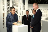 Britain's Prince William is shown a designed piece of 'magic metal' in which shapes seem to disappear by Ritsu Yamanda at the official opening of Japan House in London, Britain, September 13, 2018. Tim P. Whitby/Pool via REUTERS