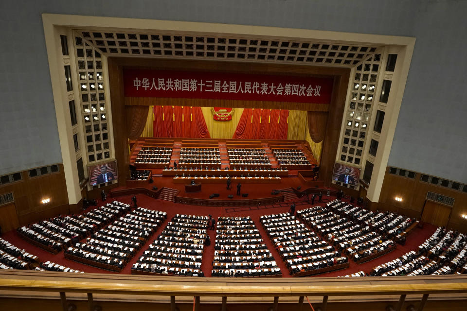 Delegates attend the opening session of China's National People's Congress (NPC) at the Great Hall of the People in Beijing, Friday, March 5, 2021. (AP Photo/Andy Wong)