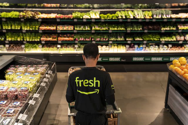 <p>David Ryder / Bloomberg via Getty Images</p> Amazon Fresh's price cuts the price cuts can go for as much as 30% off and will include meat, seafood, frozen food, beverages, snacks, dairy and cheese, pasta — and more.