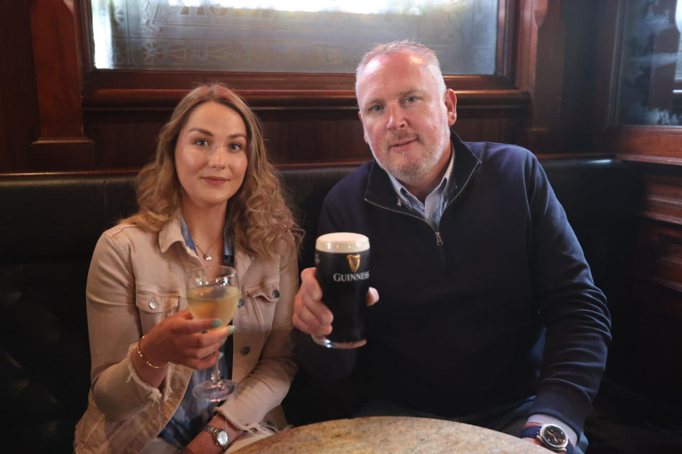 <p>Natalie Knox and Campbell Brady enjoy a drink at The Garrick Bar in Belfast, after the latest easing of the Covid-19 rules in Northern Ireland .</p>
