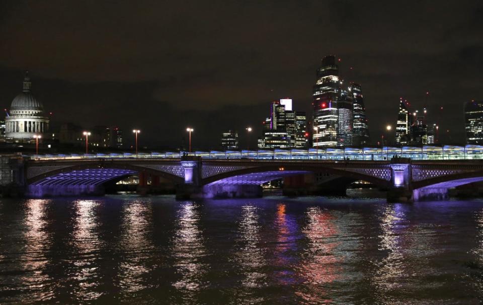 London’s landmark bridge glows purple on Monday for the Elizabeth line (Mayor of London)