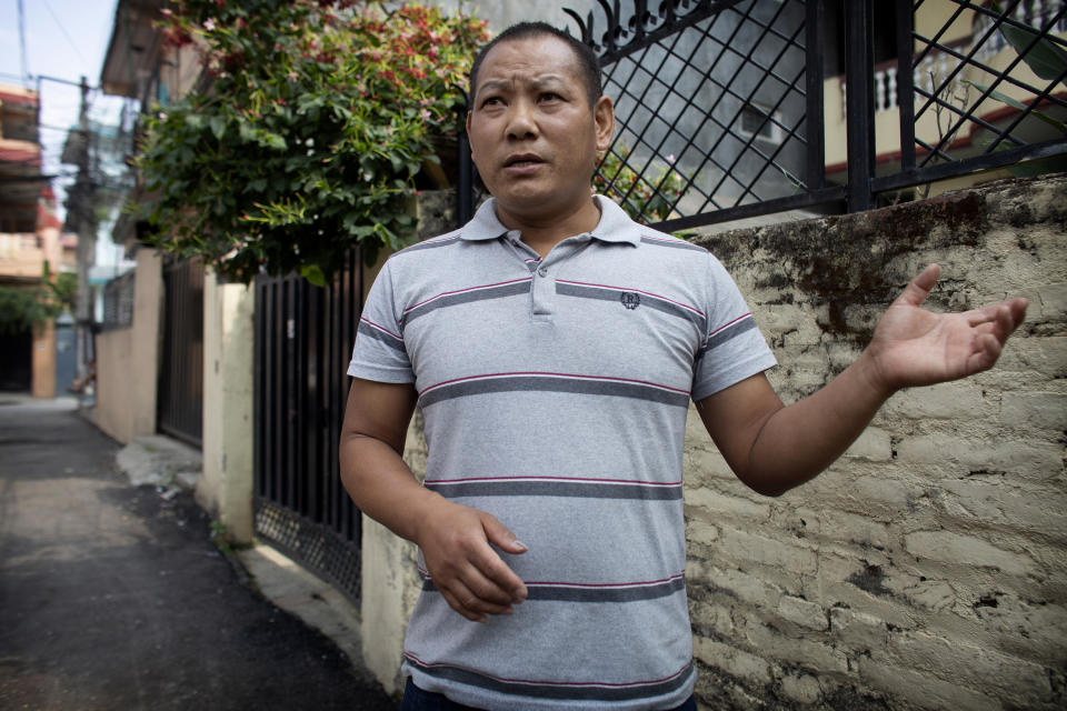 Trekking guide Ang Phurba Sherpa speaks during an interview with The Associate Press in Kathmandu, Nepal, Monday, June 7, 2021. Most Sherpa guides in Nepal famed for the climbing skills have had little or no work guiding foreign trekkers on Nepal's mountains because of the pandemic but trekking guide Ang Phurba Sherpa is spending his savings to help fellow guides and workers who are struggling for their livelihood. (AP Photos/Bikram Rai)