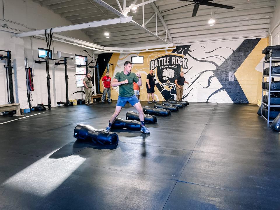 Todd Mills, owner of Battle Rock Krav Maga gym in Fountain City, demonstrates a Krav Maga technique on May 10, 2022.