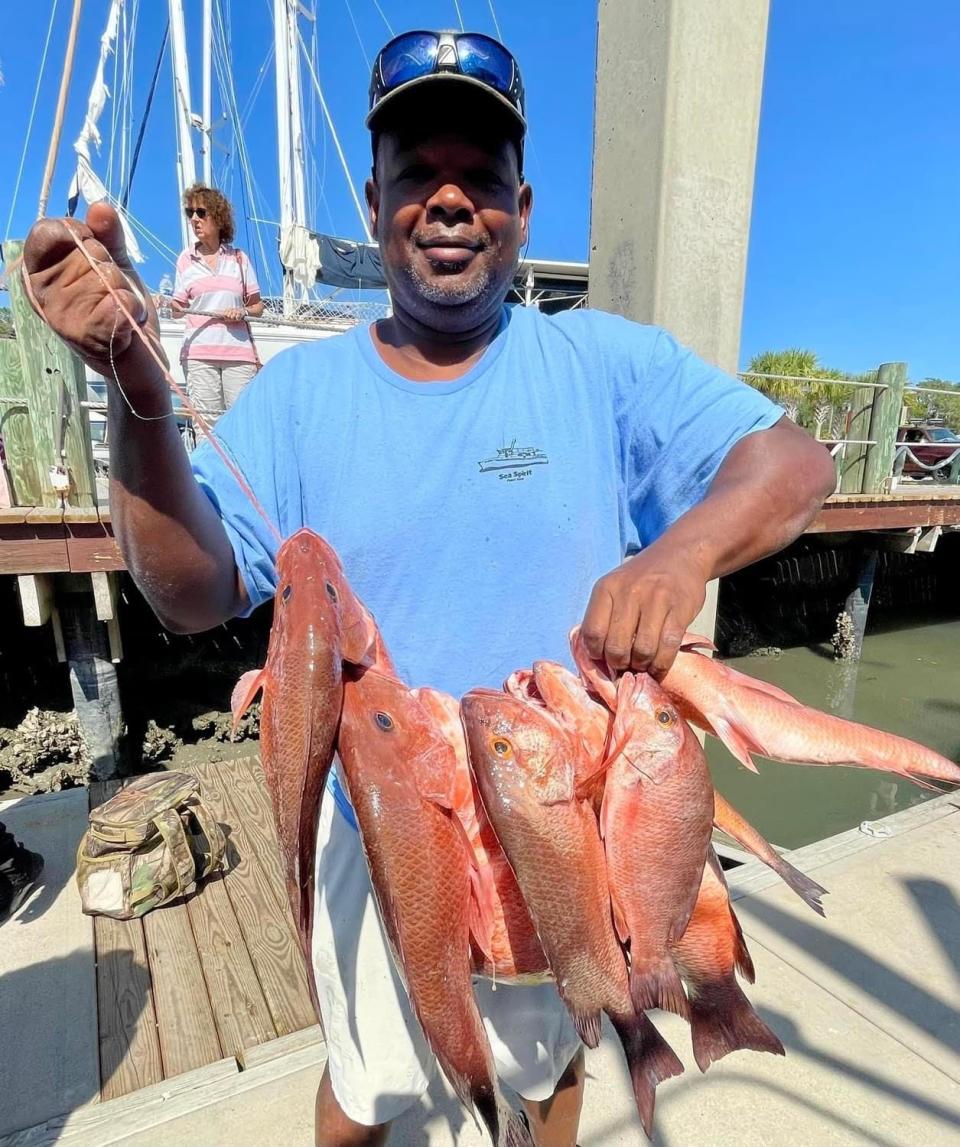 Rodrick Preston with a nice stringer of mangrove snapper he caught aboard the Sea Spirit.