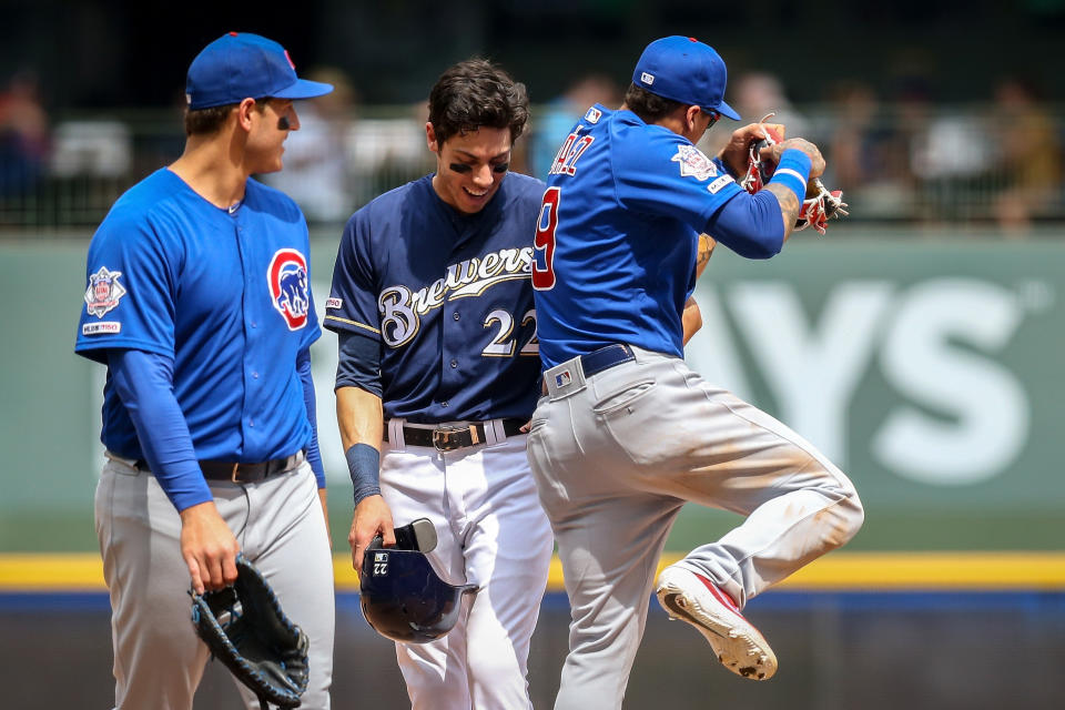 MILWAUKEE, WISCONSIN - JULY 28:  Christian Yelich #22 of the Milwaukee Brewers and Javier Baez #9 of the Chicago Cubs meet in the fifth inning at Miller Park on July 28, 2019 in Milwaukee, Wisconsin. (Photo by Dylan Buell/Getty Images)