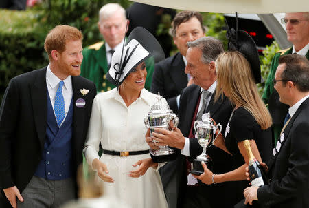 Horse Racing - Royal Ascot - Ascot Racecourse, Ascot, Britain - June 19, 2018 Britain's Prince Harry and Meghan, the Duchess of Sussex during a trophy presentation Action Images via Reuters/Andrew Boyers