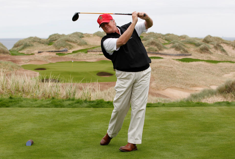 Donald Trump practices his swing at the 13th tee of his new Trump International Golf Links course on the Menie Estate near Aberdeen, Scotland, Britain June 20, 2011.