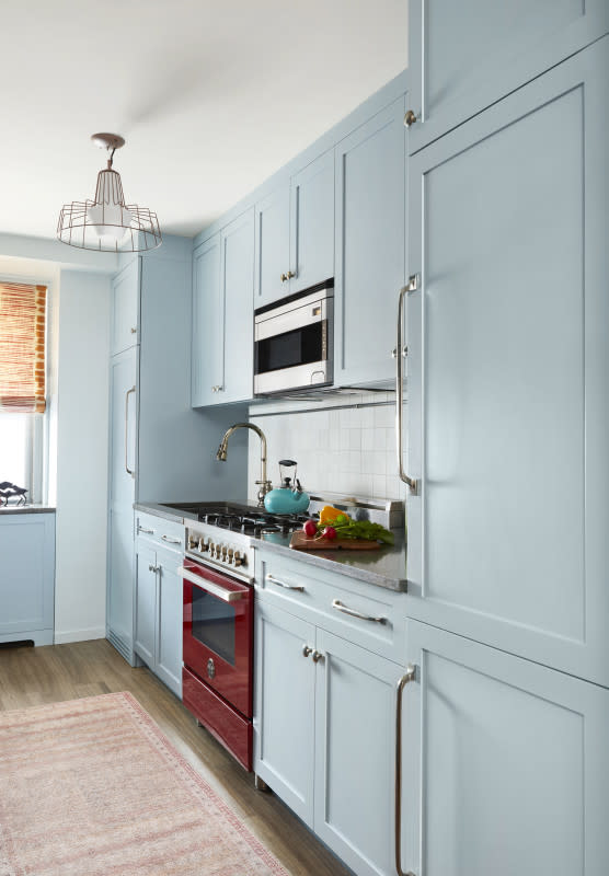 Blue cabinets are accented with a high-end red oven.<p>Bertazzoni, Courtesy of Keita Turner of Keita Turner Design, Photographer Kelly Marshall</p>