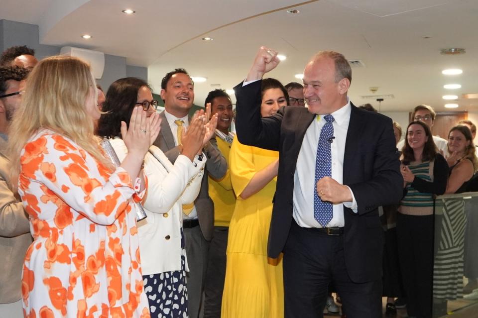 Sir Ed Davey is greeted by supporters as he returns to LibDems HQ in central London (Gareth Fuller/PA Wire)