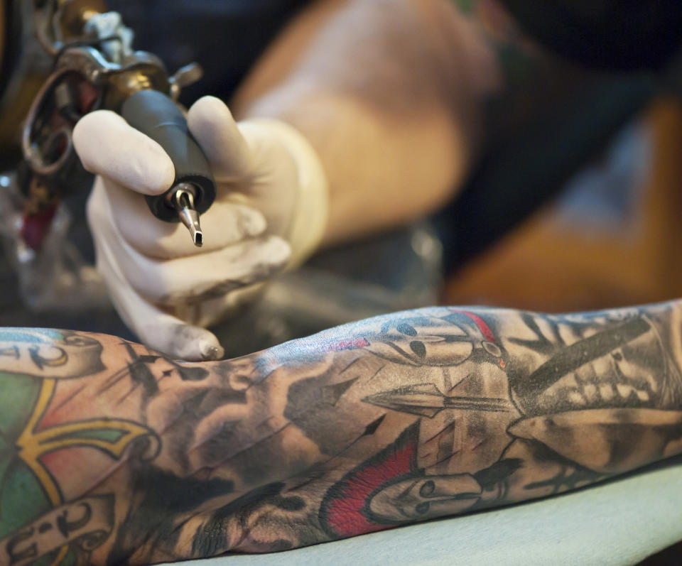 Closeup of a tattoo artist working