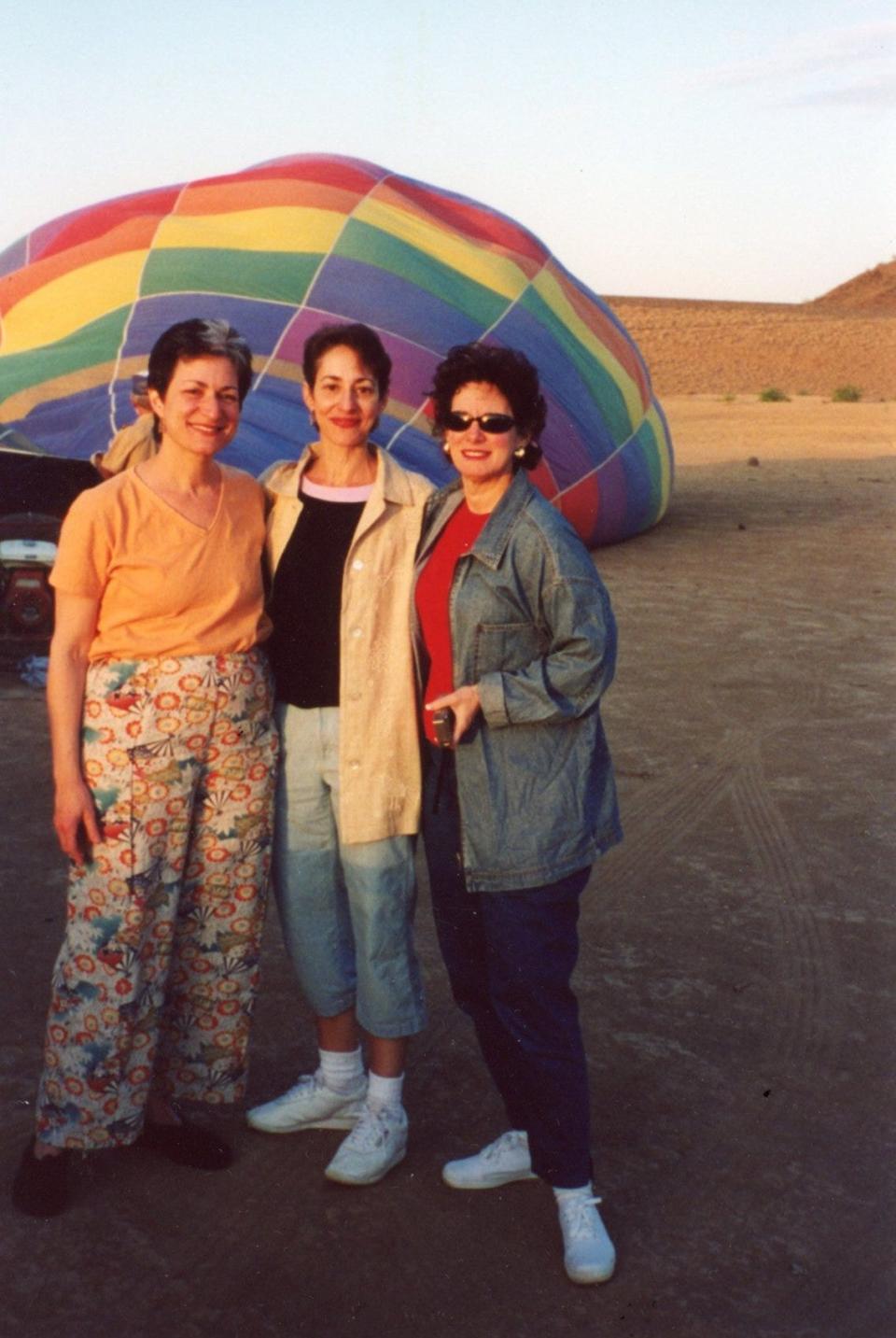 The author (middle) with her two sisters before going on a hot air balloon ride in 2002.