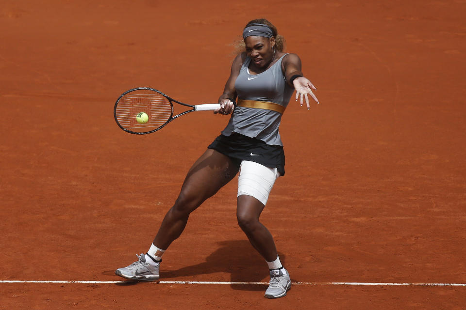 Serena Williams from US returns the ball to Shuai Peng from China during a Madrid Open tennis tournament match in Madrid, Spain, Wednesday, May 7, 2014. (AP Photo/Andres Kudacki)