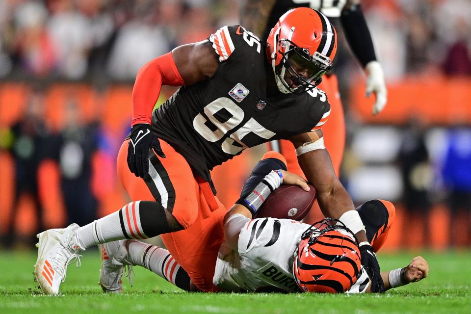 Browns defensive end Myles Garrett sacks Bengals quarterback Joe Burrow in the fourth quarter, Oct. 31, 2022, in Cleveland.