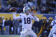 Kansas State quarterback Will Howard (18) passes against West Virginia during the first half of an NCAA college football game in Morgantown, W.Va., Saturday, Nov. 19, 2022. (AP Photo/Kathleen Batten)