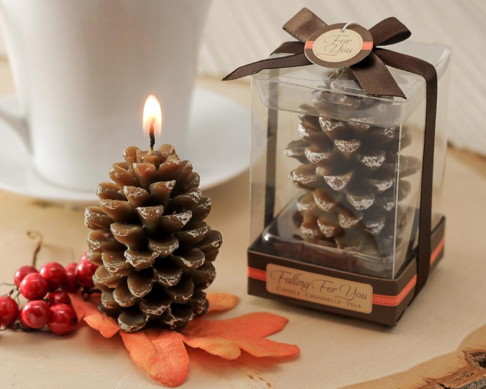 This undated product image provided by Beau-coup.com shows mini cinnamon-scented pine cone candles, a thoughtful party favor for a holiday party. (AP Photo/Beau-coup.com)