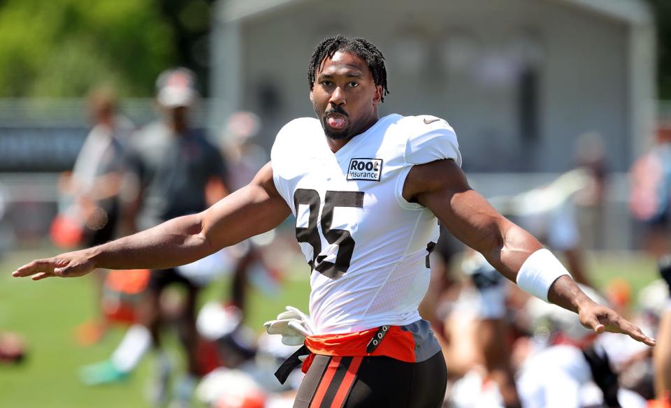 Cleveland Browns defensive end Myles Garrett goofs around as he warms up during the NFL football team's football training camp in Berea on Tuesday.