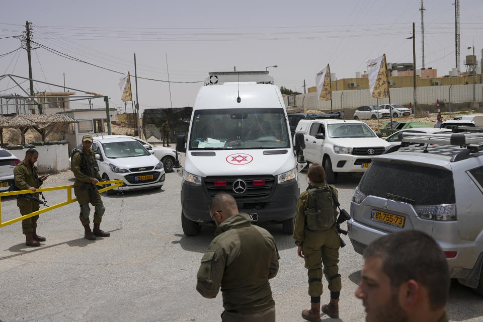 An ambulance rushes out of a military base following a deadly shootout in southern Israel along the Egyptian border, Saturday, June 3, 2023. (AP Photo/Tsafrir Abayov)