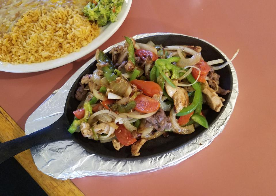 Bring your appetite and enjoy Don Garcia's chicken fajitas with rice and beans.