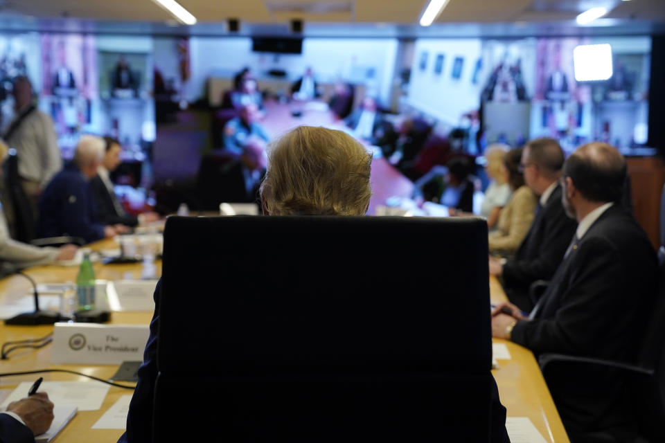 FILE - In this March 19, 2020, file photo President Donald Trump attends a teleconference with governors at the Federal Emergency Management Agency headquarters in Washington. Trump has framed his fight against the pandemic as a war, and himself a wartime president. But rather than fully lever the power of the federal government, he has increasingly put responsibility on the states, reigniting the kind of tension the nation’s founders wrestled with more than two centuries ago. (AP Photo/Evan Vucci, Pool, File)