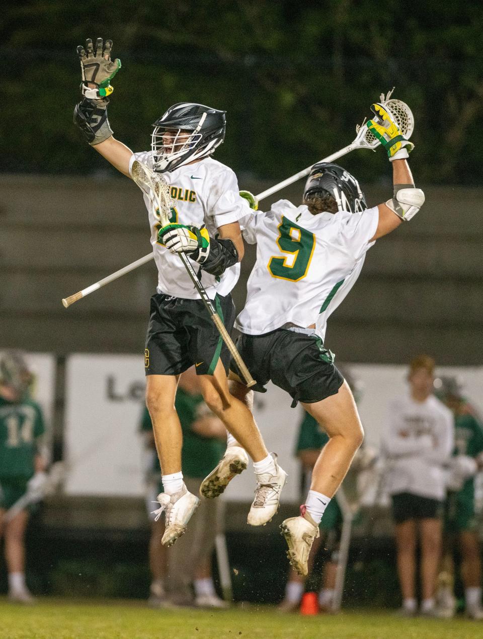 Pensacola Catholic's Hudson Mitchell (left) celebrates a goal with team mate Jackson Hager during the Pensacola Catholic vs Trinity Catholic Boys Lacrosse Region 1-1A quarterfinal Saturday, April 22, 2023 at Catholic High School.  Pensacola Catholic beat Trinity Catholic 12-8.