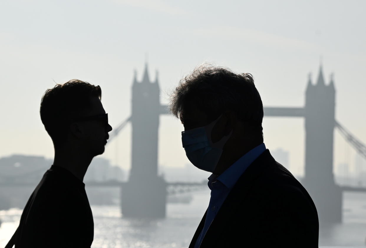 services sector  Tower Bridge is seen in the background as workers cross London Bridge during the morning rush hour in London, Britain, September 8, 2021. REUTERS/Toby Melville